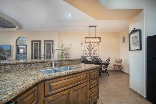 a kitchen with a sink and a counter top at Bella Sirena in La Choya