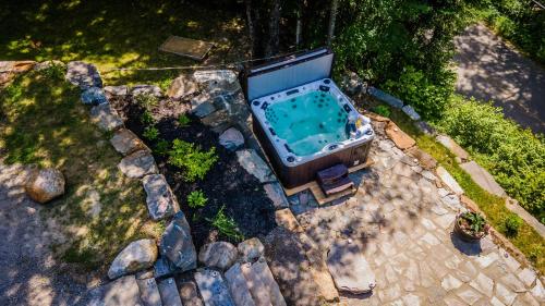 an overhead view of a hot tub in a backyard at Lake and Pool Table - Au Pied du Lac in Labelle