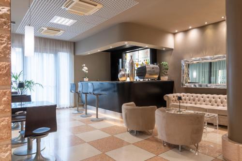a salon with chairs and a barber shop at Hotel Palace Verona in Verona