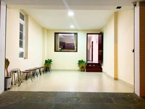 a hallway with tables and chairs in a building at Tiên Hoa Sơn Villa in Da Lat
