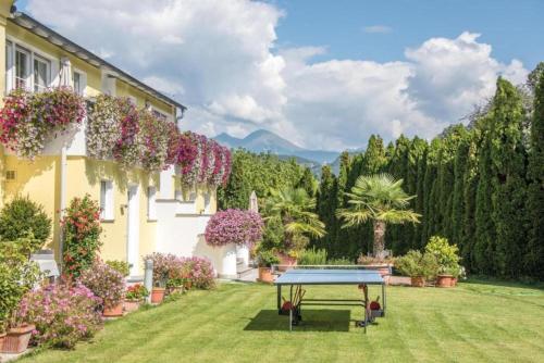 a ping pong table in the yard of a house at Gartenhof in Brixen