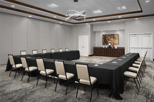 a conference room with a long table and chairs at Hilton Garden Inn Oklahoma City/Bricktown in Oklahoma City