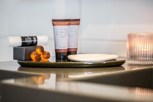 a table with a tray with some cosmetics on it at hirschen dornbirn - das boutiquestyle hotel - skyrelax & wellness im rooftop in Dornbirn