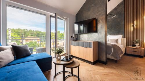 Postel nebo postele na pokoji v ubytování Jantar Resort Flatbook - Wynajem Apartamentów nad Morzem