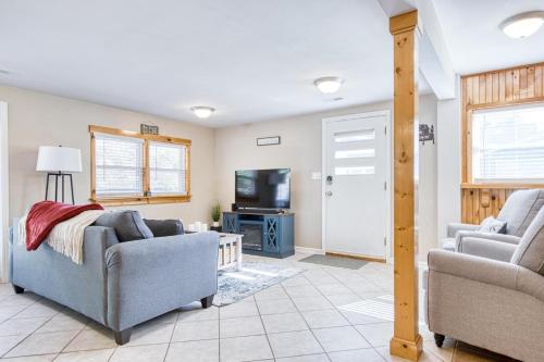 a living room with two couches and a tv at New River 3BR - Fishing, Hot Tub and VT Game Weekends in Radford