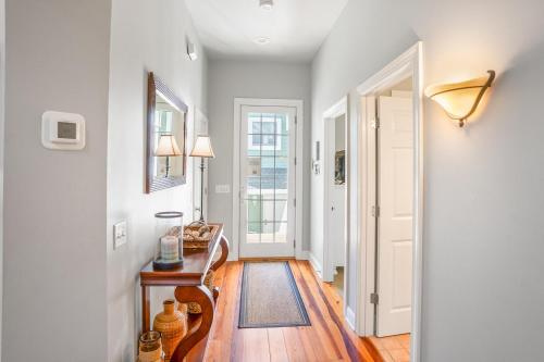 a hallway with a table and a mirror and a door at Tasteful 2 Story 4 Bedroom, 4 Bath Home! New on Rental Program, Sleeps 12! in Fripp Island