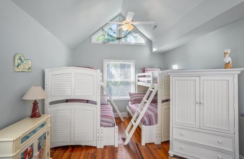 a room with two bunk beds and a ladder at Tasteful 2 Story 4 Bedroom, 4 Bath Home! New on Rental Program, Sleeps 12! in Fripp Island