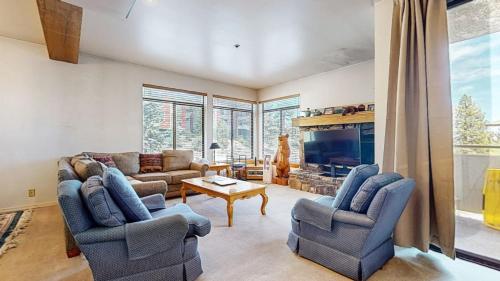 a living room with two couches and a fireplace at Silver Bear 18 Condo in Mammoth Lakes