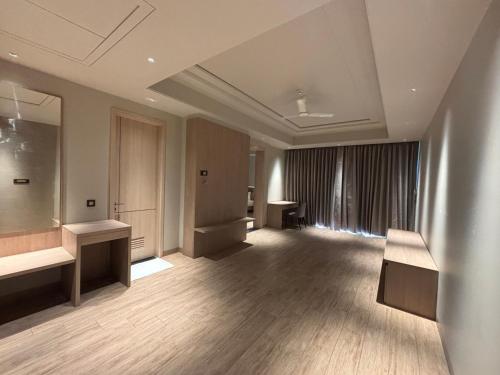 a large empty room with a hair salon at The Supreme Hotel and Banquet in Gaya