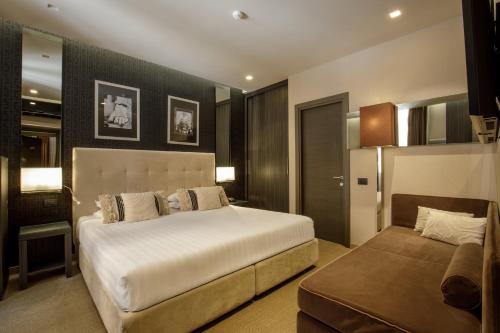 Cama o camas de una habitación en Condotti Boutique Hotel