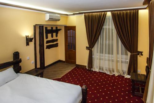 Postel nebo postele na pokoji v ubytování Kodatskiy Kosh