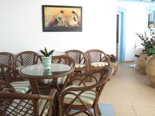 a dining room with a table and chairs at Villa Katerina in Parikia