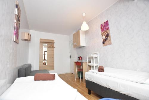 Katil atau katil-katil dalam bilik di City Central Hostel - Pokoje prywatne