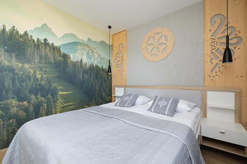 Un pat sau paturi într-o cameră la Piękny Górski Apartament z Widokiem i Parkingiem by Noclegi Renters