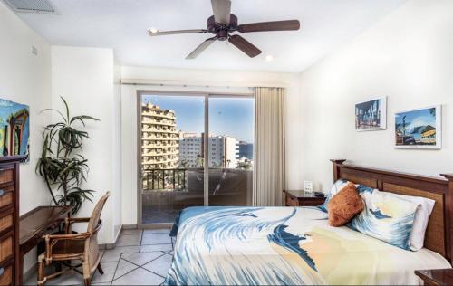 a bedroom with a bed and a ceiling fan at Bella Sirena in La Choya
