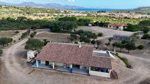 an aerial view of a house with a red roof at Molti Mari B&B Resort in Olbia