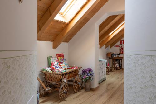 a hallway with a wooden wagon in a house at Agriturismo Filippon 
