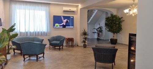 Μια τηλεόραση ή/και κέντρο ψυχαγωγίας στο B&B Villa Dina