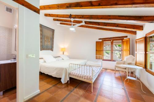 Ένα ή περισσότερα κρεβάτια σε δωμάτιο στο Casa Rural Molino Del Machero