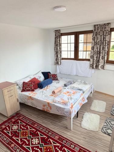 a bed in a room with a bed sidx sidx sidx at Hattuşa Hostel in Prizren