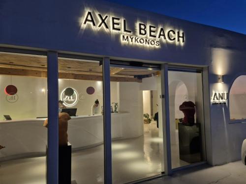 a building with a sign that reads ayel beach museums at Axel Beach Mykonos - Adults Only in Mýkonos City