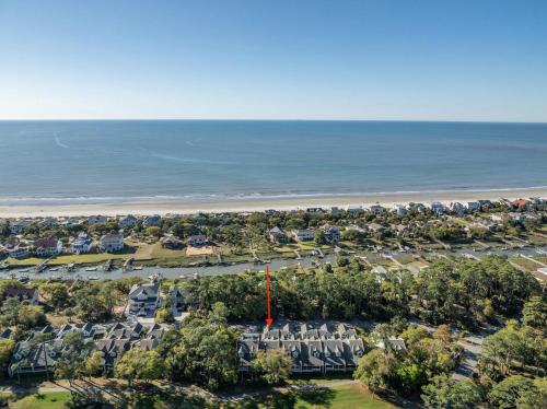 an aerial view of a parking lot with houses and the beach at Tasteful 2 Story 4 Bedroom, 4 Bath Home! New on Rental Program, Sleeps 12! in Fripp Island