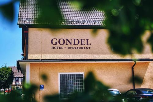 a sign for a hotel on the side of a building at Hotel Gondel in Altenkunstadt