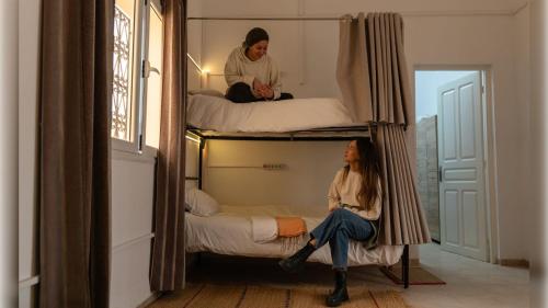 Ein Bett oder Betten in einem Zimmer der Unterkunft CoZi Coliving Djerba
