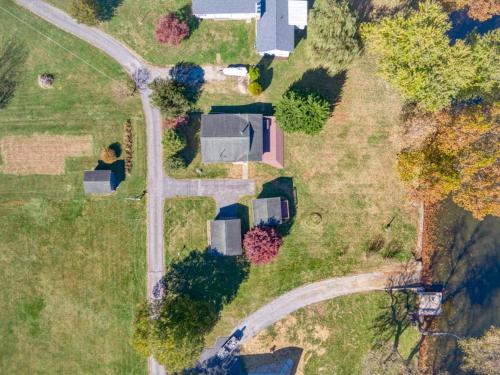 an aerial view of a house and a road at New River 3BR - Fishing, Hot Tub and VT Game Weekends in Radford