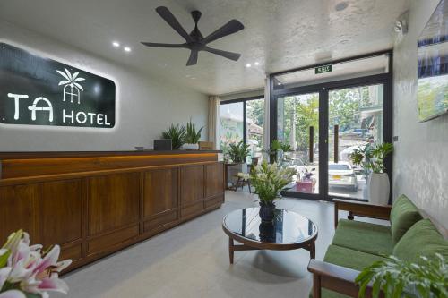 a hotel lobby with a couch and a table at TA Hotel - Hue City Center in Hue