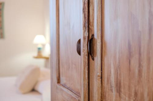 Ένα ή περισσότερα κρεβάτια σε δωμάτιο στο Agriturismo Cultisia Luogosanto