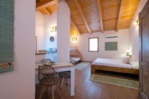 Ένα ή περισσότερα κρεβάτια σε δωμάτιο στο Agriturismo Cultisia Luogosanto