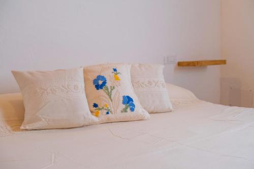Ένα ή περισσότερα κρεβάτια σε δωμάτιο στο Agriturismo Cultisia Luogosanto