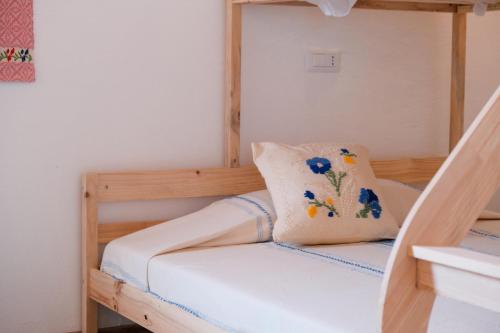 Ένα ή περισσότερα κρεβάτια σε δωμάτιο στο Agriturismo Cultisia Luogosanto