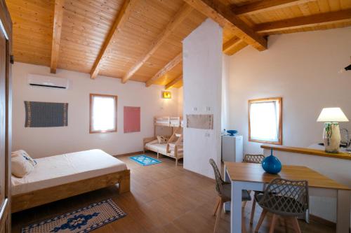 Ένα ή περισσότερα κρεβάτια σε δωμάτιο στο Agriturismo Cultisia Luogosanto