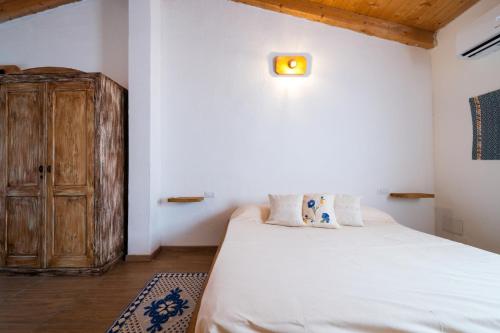 Ένα ή περισσότερα κρεβάτια σε δωμάτιο στο Agriturismo Cultisia Luogosanto