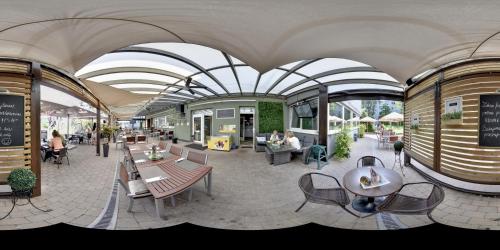 a building with tables and chairs and people sitting at Penzion Set in Košice