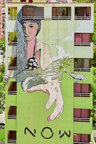 a painting of a woman on the side of a building at Now Benidorm in Benidorm