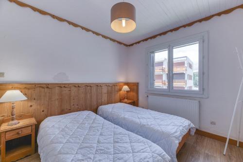 Ένα ή περισσότερα κρεβάτια σε δωμάτιο στο Appartement Choucas