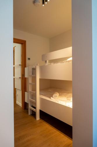 a room with two bunk beds in it at Villa Marsel Oostduinkerke in Oostduinkerke