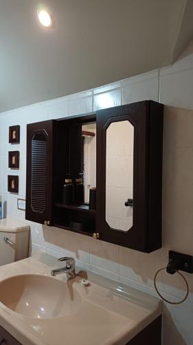 a bathroom with a sink and a mirror at Panorama Self Catering 2 in Panorama