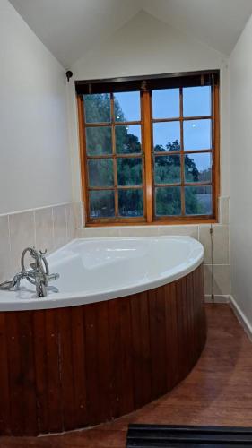 a bath tub in a bathroom with a window at Panorama Self Catering 2 in Panorama