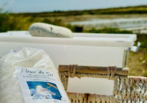 a white sink with a bag of food on it at Charming fisherman's cottage in Ars en Ré in Ars-en-Ré