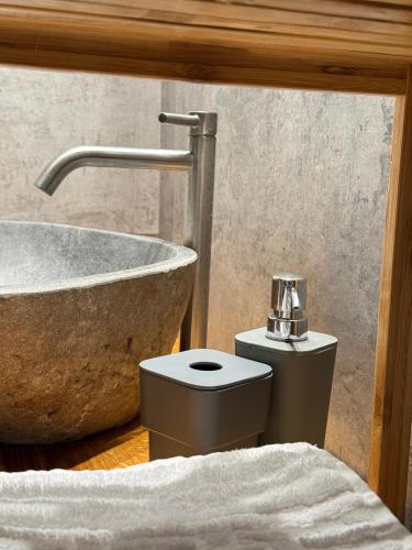 a bathroom with a sink and a tub and a toilet at ZEN Apartments in Măgura
