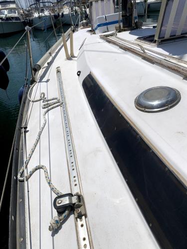 a close up of the side of a boat at Notte in barca tra gioia e relax cullati dal mare in Civitavecchia