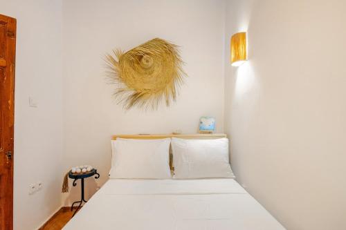 En eller flere senge i et værelse på Dar Karie