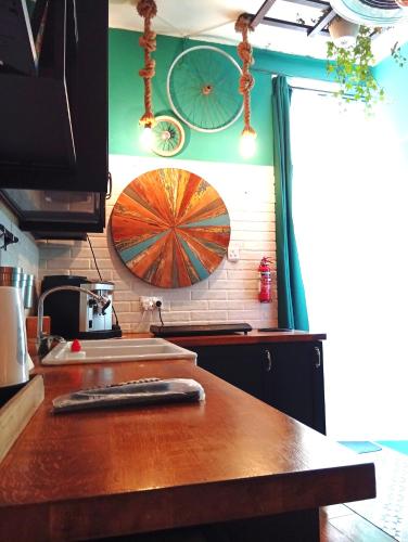 a kitchen with a wooden counter top and a sink at Fusion Homestay Accommodation in Mosta
