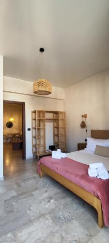 a bedroom with a large bed in a room at Taga Suites in Catania