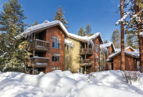 an apartment building with snow in front of it at Wyndham South Shore 1BR Apartment with Resort Access in Zephyr Cove