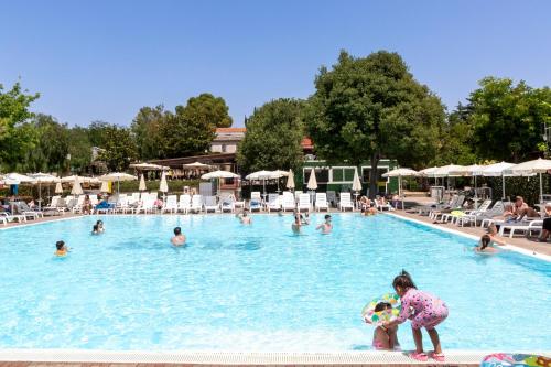 a group of people in a swimming pool at hu Roma Camping In Town in Rome